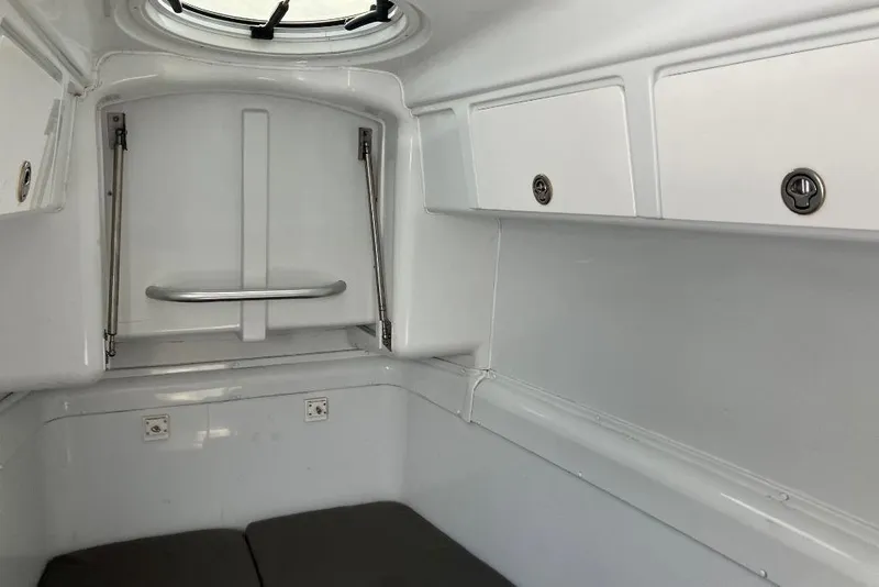 Slide: The Image of Interior cabin of 2012 Yellowfin 42 Offshore boat, featuring white storage compartments. - 20