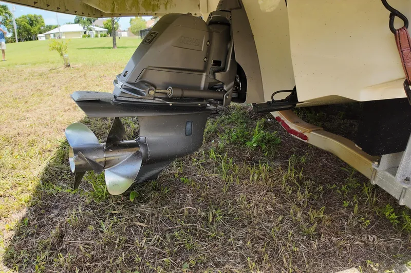 Slide: The Image of 2018 Regal 2300 Bowrider boat propeller and stern drive on grassy ground. - 20