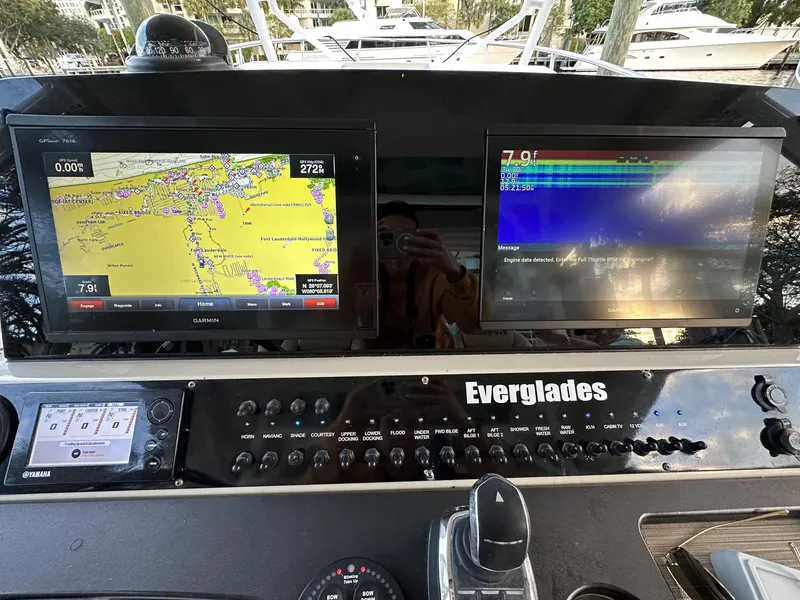 Slide: The Image of Dashboard of 2017 Everglades 360 LXC boat with navigation screens. - 17