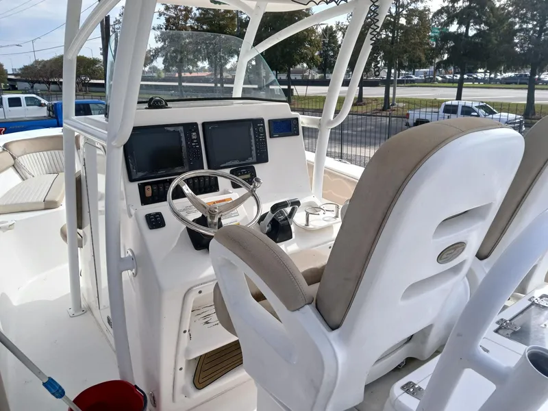 Slide: The Image of 2015 Sea Fox 286 Commander boat cockpit with steering wheel and navigation screens. - 6