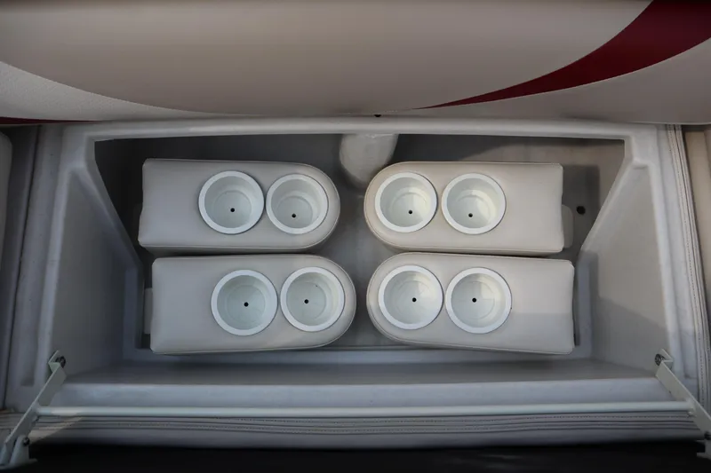 Slide: The Image of Cup holders inside a 2005 Crest 25 Caribbean boat storage compartment. - 12