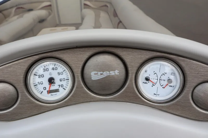 Slide: The Image of Dashboard of 2005 Crest 25 Caribbean boat with speedometer and fuel gauge. - 26