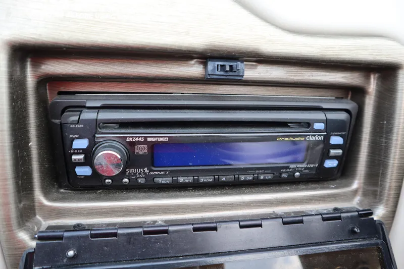 Slide: The Image of Clarion ProAudio stereo system in 2005 Crest 25 Caribbean boat dashboard. - 28