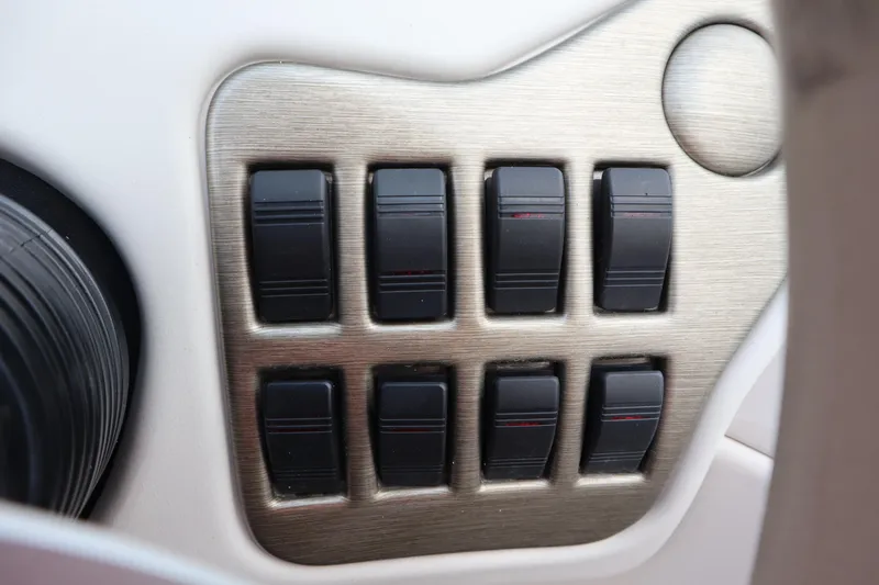 Slide: The Image of Control panel with switches on a 2005 Crest 25 Caribbean boat. - 29