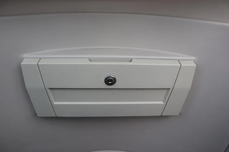 Slide: The Image of White storage compartment on 2005 Crest 25 Caribbean boat. - 30