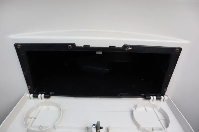 Slide: The Image of Open storage compartment on a 2005 Crest 25 Caribbean boat. - 31