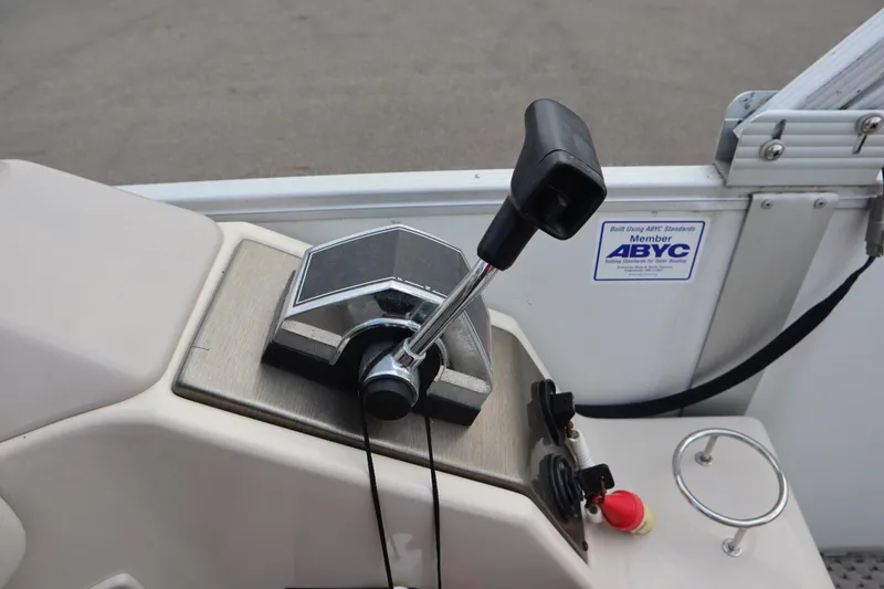 Slide: The Image of Control panel of a 2005 Crest 25 Caribbean boat with throttle lever and ABYC certification. - 34