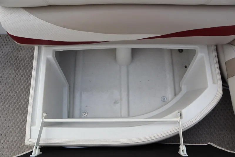 Slide: The Image of Open storage compartment in a 2005 Crest 25 Caribbean boat seat. - 41