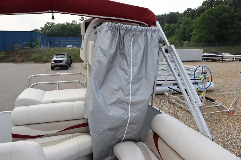 Slide: The Image of 2005 Crest 25 Caribbean boat with canopy and seating, parked in a lot. - 42