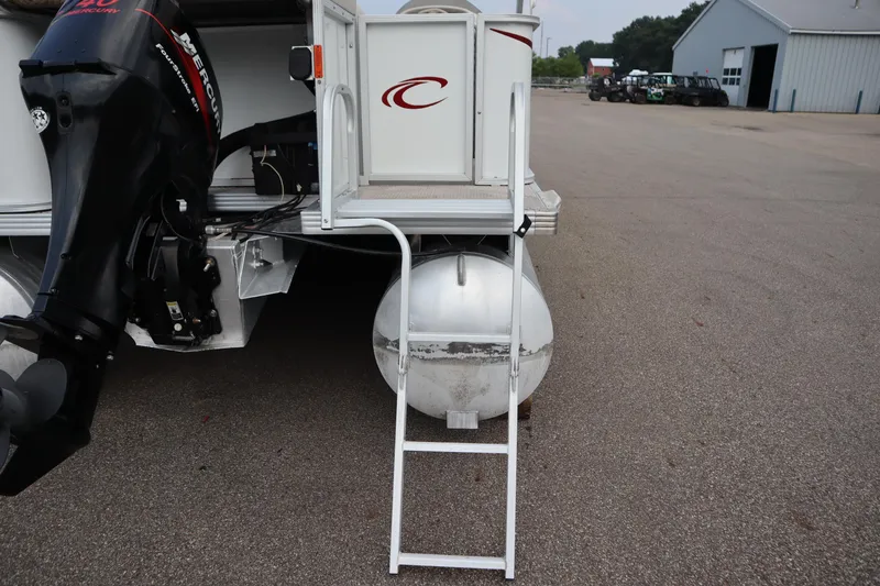 Slide: The Image of Rear view of a 2005 Crest 25 Caribbean boat with ladder and Mercury outboard motor. - 45