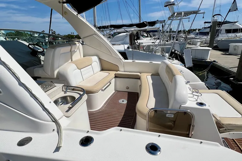 Slide: The Image of 2010 Sea Ray 350 Sundancer yacht interior with plush seating and sleek design. - 14