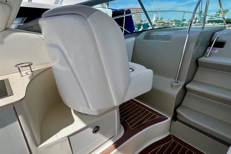 Slide: The Image of Interior of 2010 Sea Ray 350 Sundancer with helm seat and steps. - 17