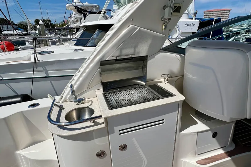Slide: The Image of Outdoor kitchenette on a 2010 Sea Ray 350 Sundancer yacht with sink and grill. - 19