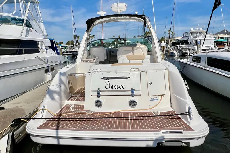 Slide: The Image of 2010 Sea Ray 350 Sundancer yacht named "Grace" docked at a marina. - 3