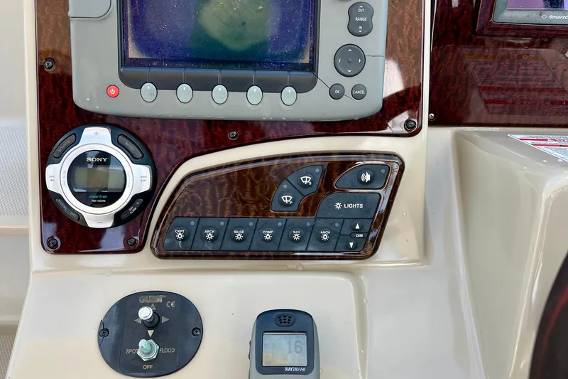 Slide: The Image of Control panel of a 2010 Sea Ray 350 Sundancer boat with navigation and audio systems. - 31