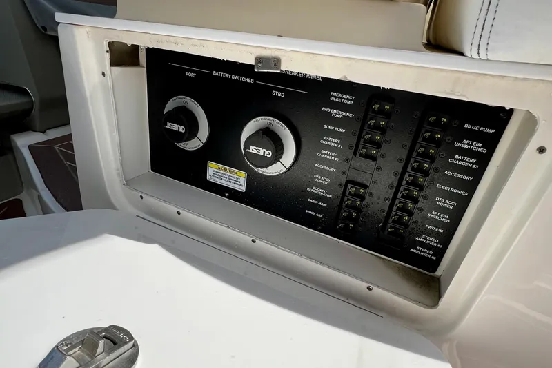 Slide: The Image of Control panel of 2010 Sea Ray 350 Sundancer boat with battery switches and breaker panel. - 35
