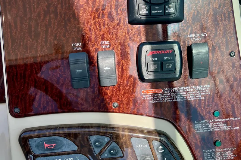 Slide: The Image of Control panel of a 2010 Sea Ray 350 Sundancer boat with Mercury engine controls. - 37