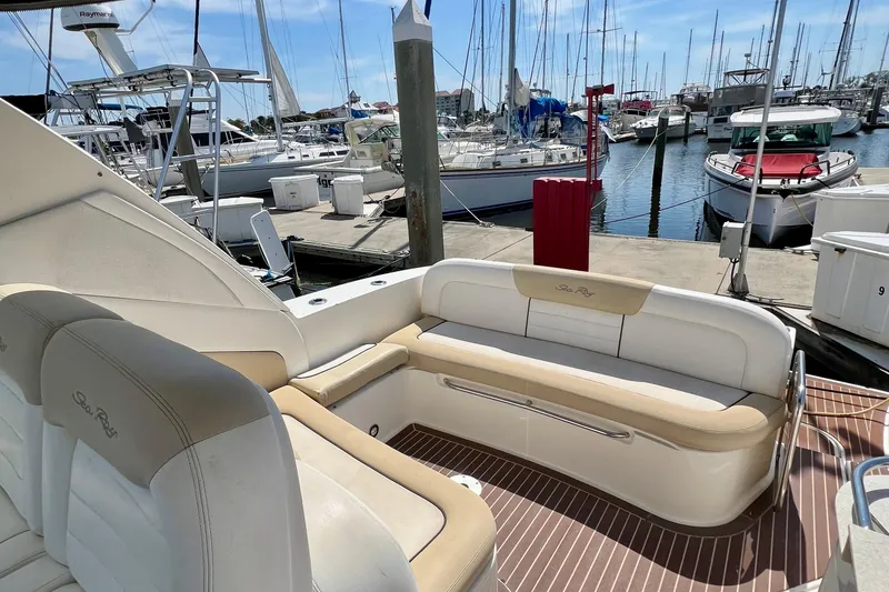 Slide: The Image of 2010 Sea Ray 350 Sundancer yacht interior with white seating at marina. - 40