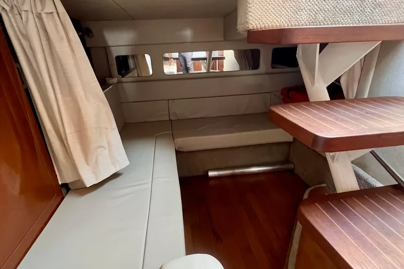 Slide: The Image of Interior cabin of 2010 Sea Ray 350 Sundancer with wooden steps and seating area. - 43