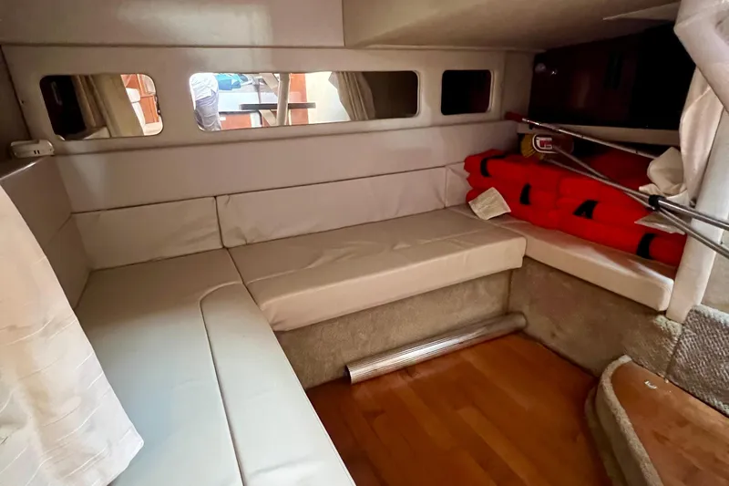 Slide: The Image of Interior cabin of 2010 Sea Ray 350 Sundancer with seating and life jackets. - 44