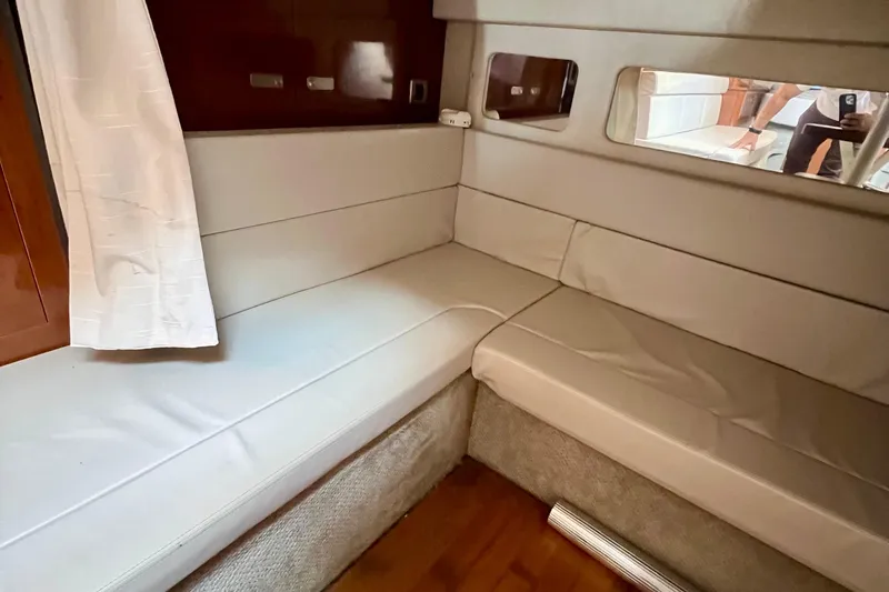 Slide: The Image of Interior seating area of 2010 Sea Ray 350 Sundancer yacht with white upholstery. - 45