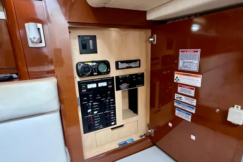 Slide: The Image of Electrical control panel inside 2010 Sea Ray 350 Sundancer boat cabin. - 46