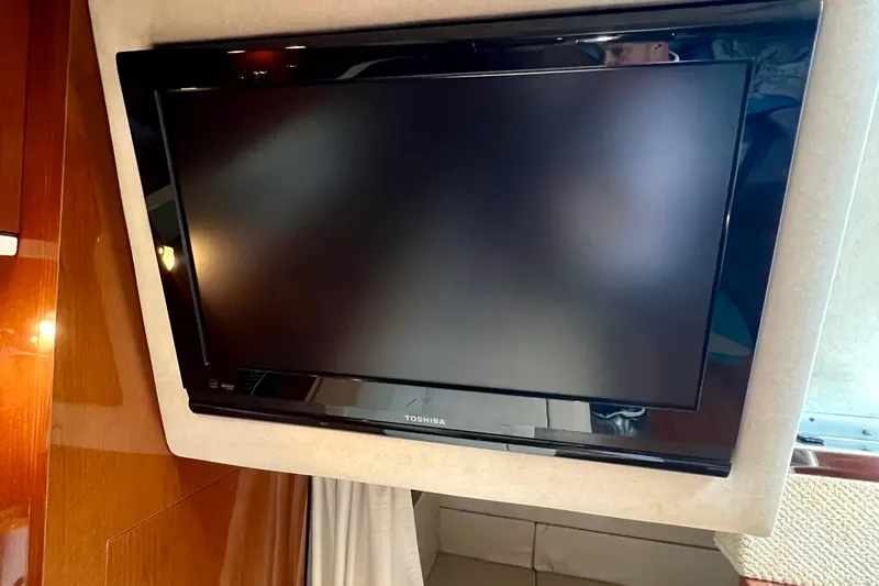 Slide: The Image of Toshiba TV inside 2010 Sea Ray 350 Sundancer yacht cabin. - 52