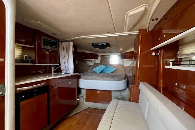 Slide: The Image of Luxurious interior of 2010 Sea Ray 350 Sundancer yacht with cozy bed and modern amenities. - 55