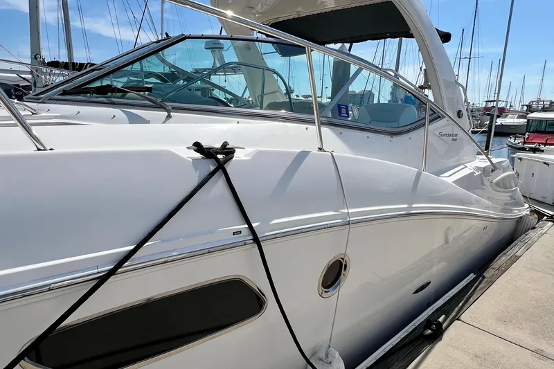 Slide: The Image of 2010 Sea Ray 350 Sundancer yacht docked at marina, side view. - 6