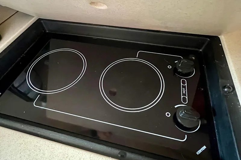 Slide: The Image of Electric stove in 2010 Sea Ray 350 Sundancer yacht kitchen. - 61