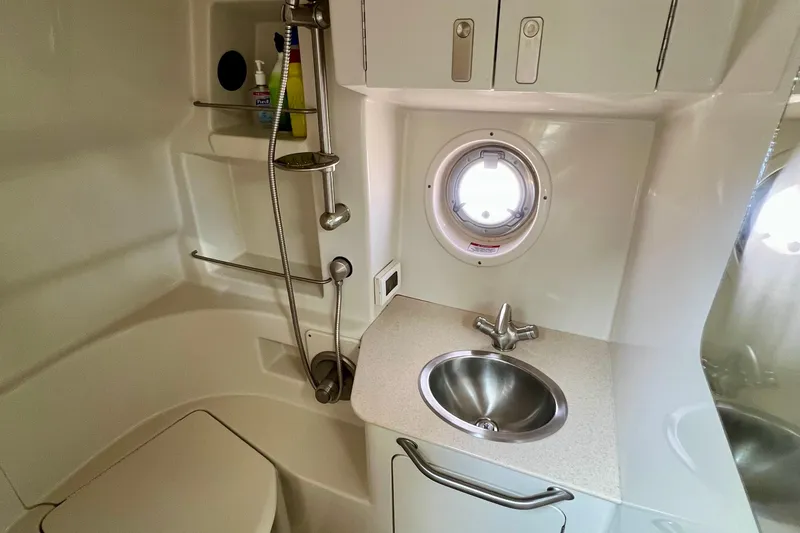 Slide: The Image of Bathroom interior of 2010 Sea Ray 350 Sundancer yacht with sink and shower. - 64