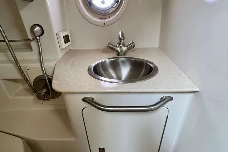 Slide: The Image of Compact bathroom sink area on 2010 Sea Ray 350 Sundancer yacht. - 65