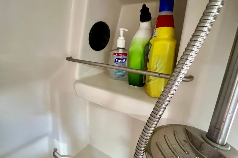 Slide: The Image of Shower shelf with cleaning supplies on a 2010 Sea Ray 350 Sundancer yacht. - 67