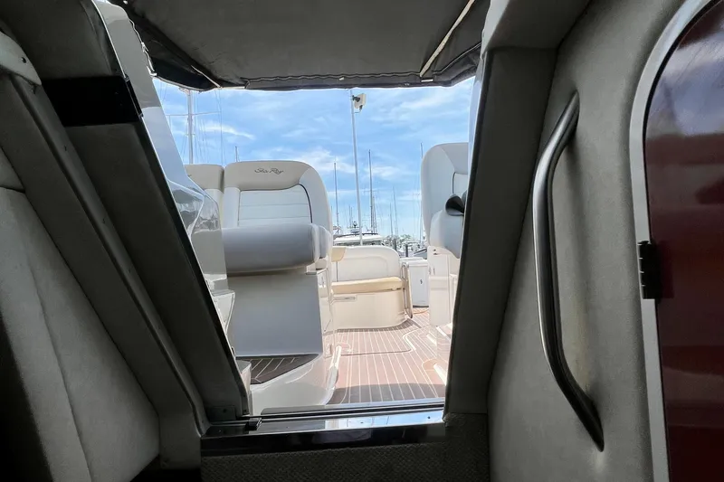 Slide: The Image of Interior view of 2010 Sea Ray 350 Sundancer yacht, showcasing seating and deck area. - 68