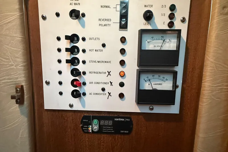 Slide: The Image of Electrical control panel on a 1986 Sea Ray 300 Weekender boat. - 23
