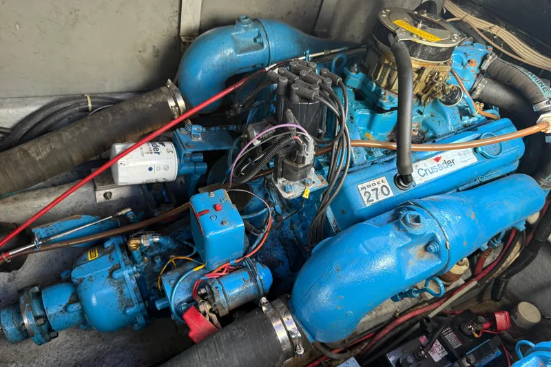 Slide: The Image of Engine of a 1986 Sea Ray 300 Weekender boat, featuring a Crusader Model 270. - 25