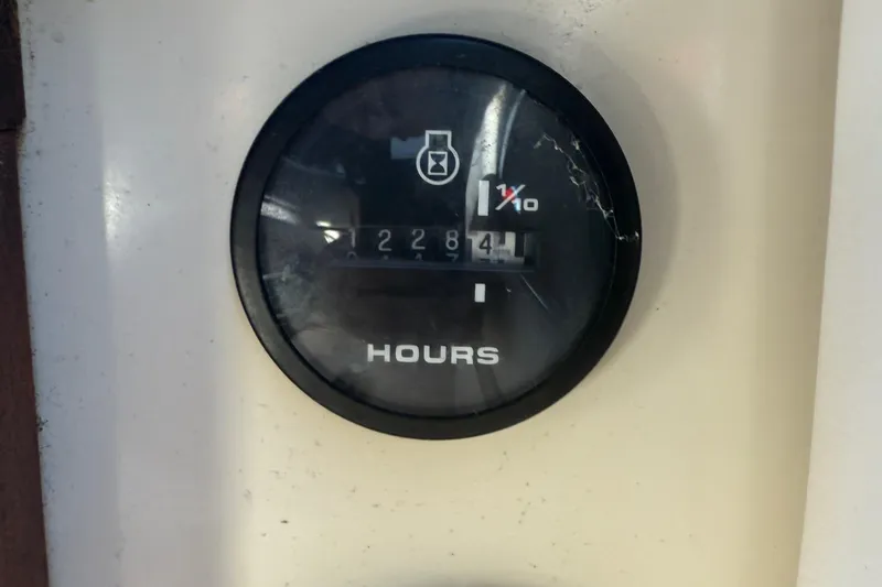 Slide: The Image of Hour meter reading 2284.1 on 1986 Sea Ray 300 Weekender boat. - 27