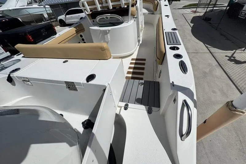 Slide: The Image of 2016 NauticStar 25 XS boat interior with seating and storage compartments. - 10