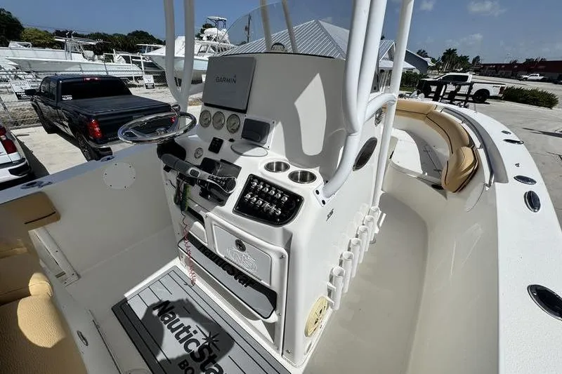 Slide: The Image of 2016 NauticStar 25 XS boat console with Garmin navigation and control panel. - 19