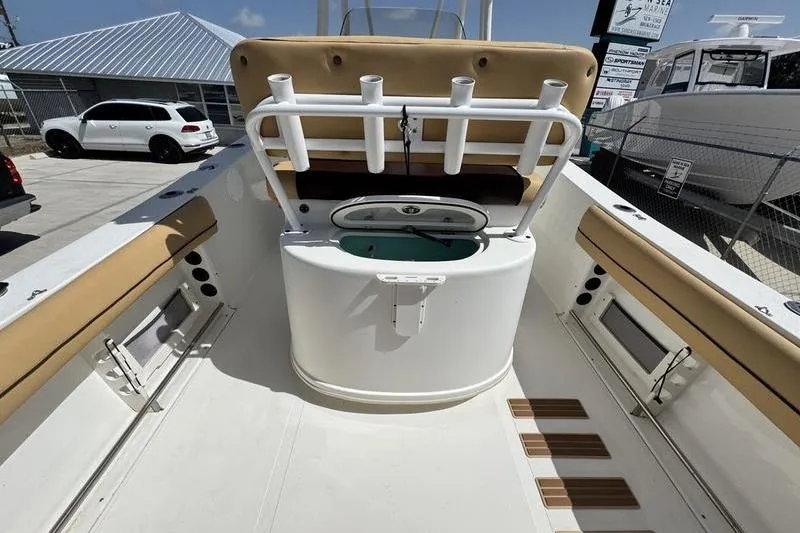 Slide: The Image of 2016 NauticStar 25 XS boat interior with rod holders and seating. - 28
