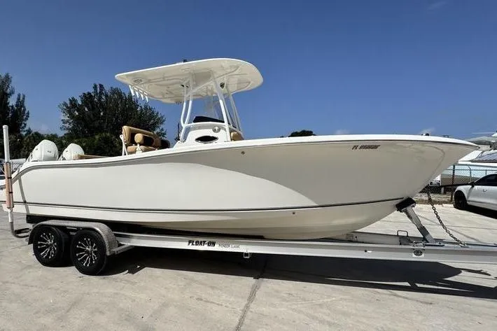 Slide: The Image of 2016 NauticStar 25 XS boat on trailer, side view, sunny day. - 4