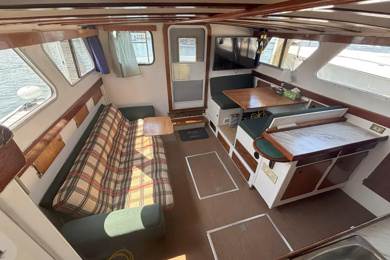Slide: The Image of Interior of 1985 Rosborough RF-35 Atlantic Trawler with seating, table, and windows. - 8
