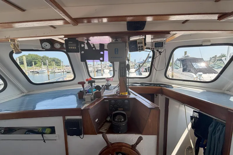 Slide: The Image of Interior view of 1985 Rosborough RF-35 Atlantic Trawler's helm with navigation instruments. - 9