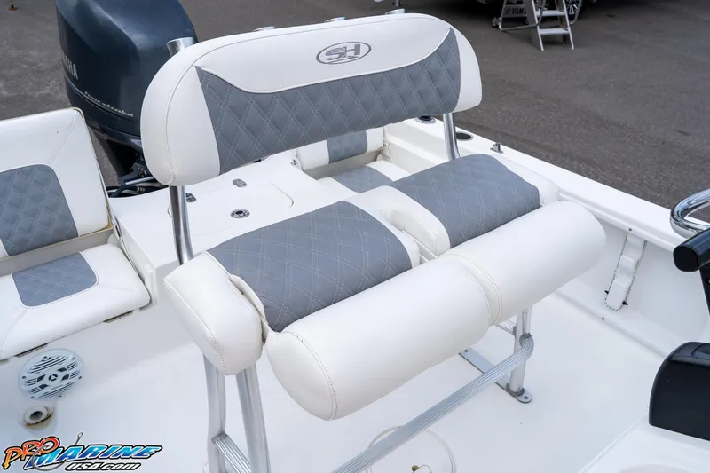 Slide: The Image of 2015 Sea Hunt BX 20 BR boat seat with gray and white cushioned design. - 19