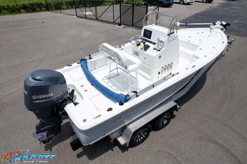 Slide: The Image of 2015 Sea Hunt BX 20 BR boat with Yamaha engine on trailer, parked outdoors. - 22