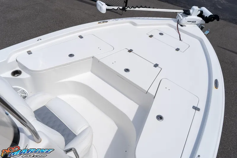 Slide: The Image of 2015 Sea Hunt BX 20 BR boat deck with storage compartments and seating. - 25