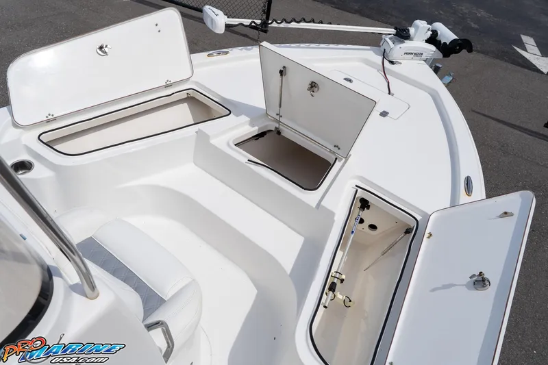 Slide: The Image of 2015 Sea Hunt BX 20 BR boat with open storage compartments and Minn Kota trolling motor. - 27