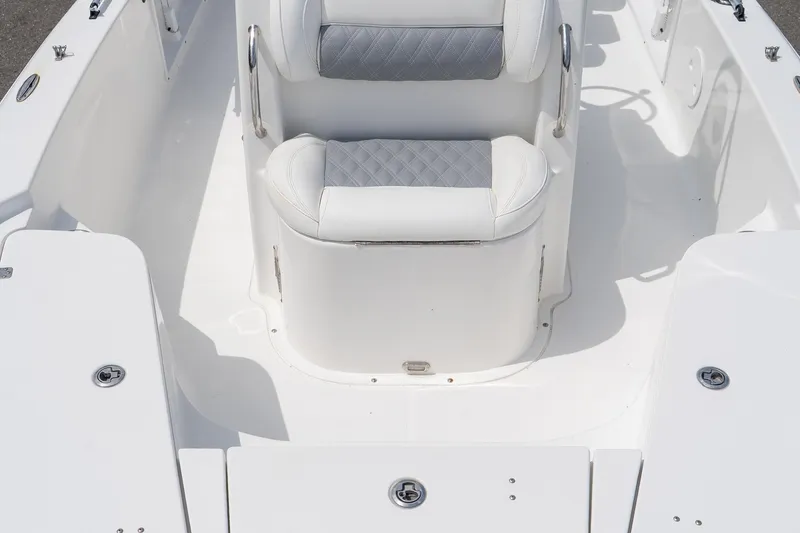 Slide: The Image of 2015 Sea Hunt BX 20 BR boat interior with white cushioned seating. - 33