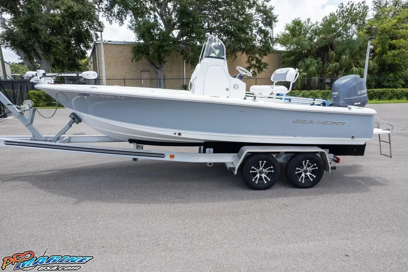 Slide: The Image of 2015 Sea Hunt BX 20 BR boat on trailer with canopy, parked outdoors. - 5