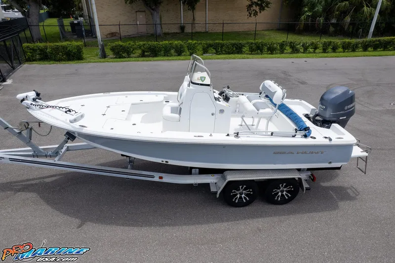 Slide: The Image of 2015 Sea Hunt BX 20 BR boat with Yamaha 150 engine, parked outdoors. - 7